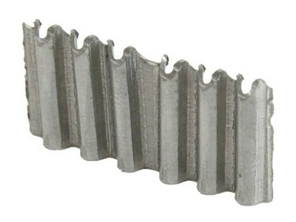 A piece of X corrugated fasteners with sharp chisel point.